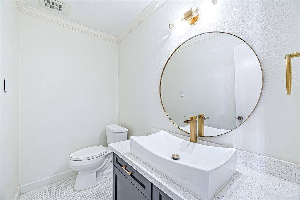 A compact and stylish half bath located on the main floor for easy access.