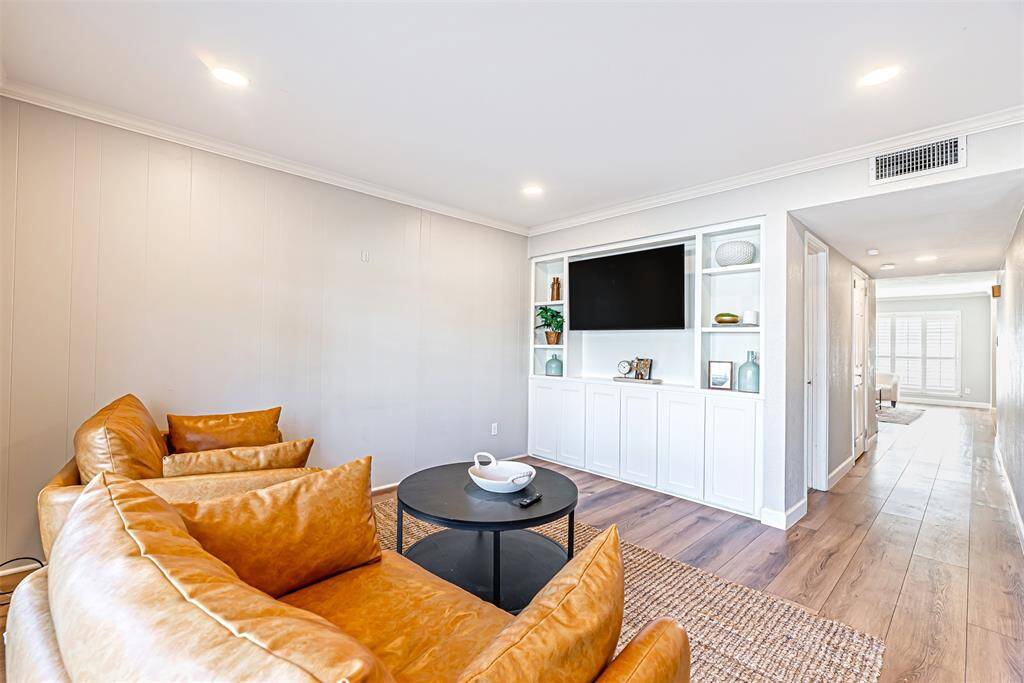 An additional view of the den, emphasizing its comfortable seating area and functionality.