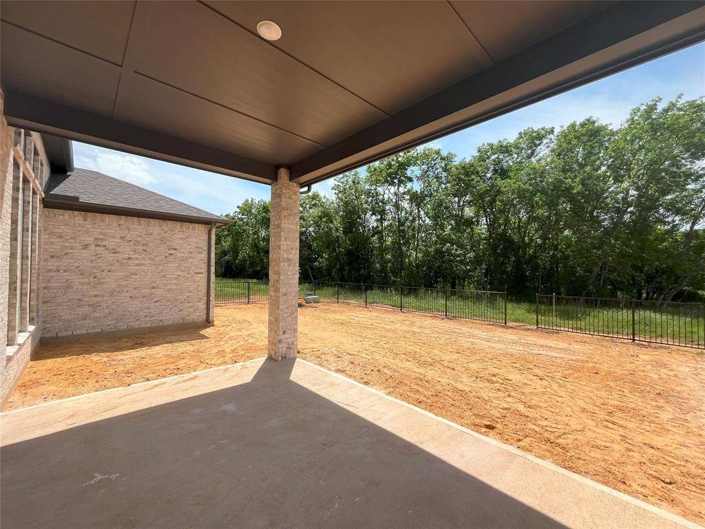 Back patio with beautiful view of the greenbelt.