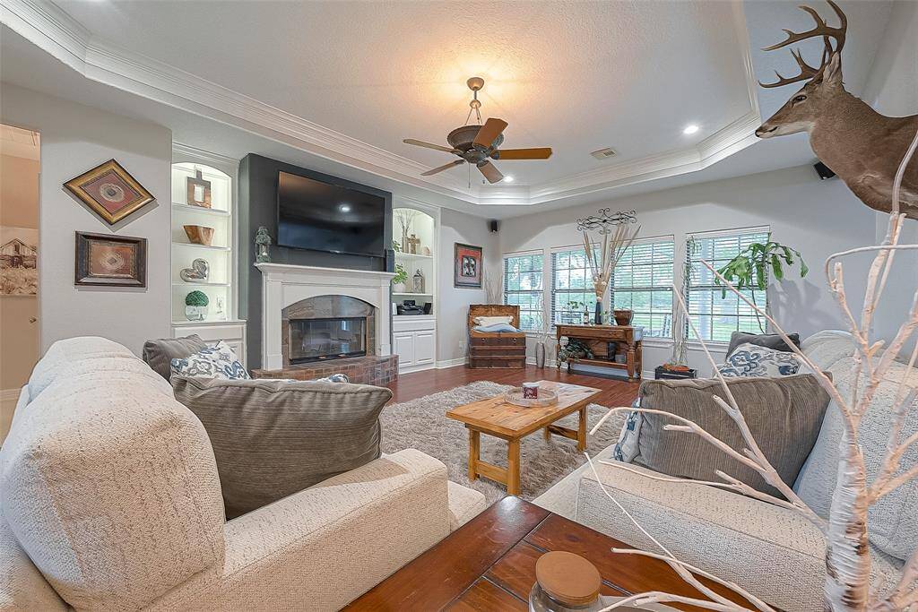 Living room is large and features gas fireplace