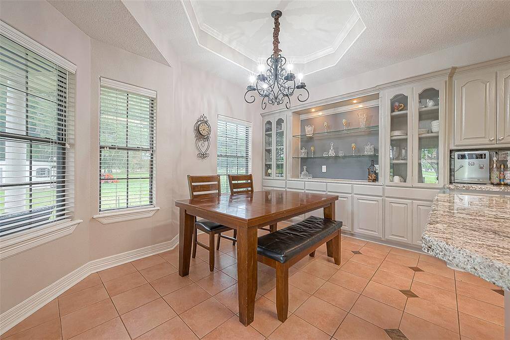 Dining room with rear window views and built-in cabinetry