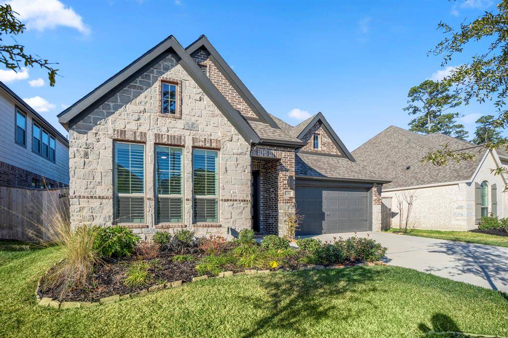 A prominent front door with glass panels, and a two-car garage. The home is situated on a cul-de-sac in a well-kept neighborhood with similar styles, adding to the cohesive and upscale feel. You are within walking distance to a park, and biking distance the community center, pool and shopping. Choose you next lunch date or breakfast stop destination from the many restaurants close by.