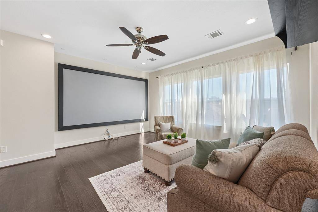 Oversized game room has a theater screen and equipment staying!