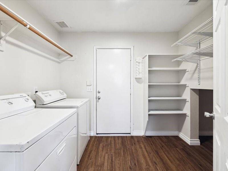 Pantry space and utility room located within the kitchen.