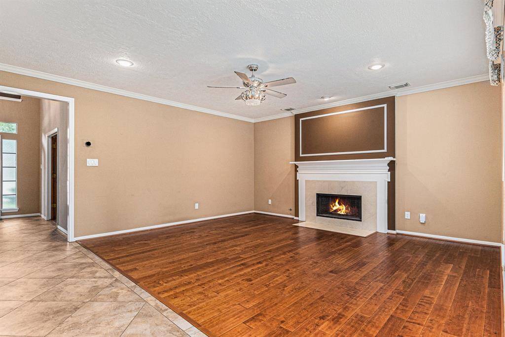 The spacious Breakfast room with expansive windows overlooks the back patio and pool.