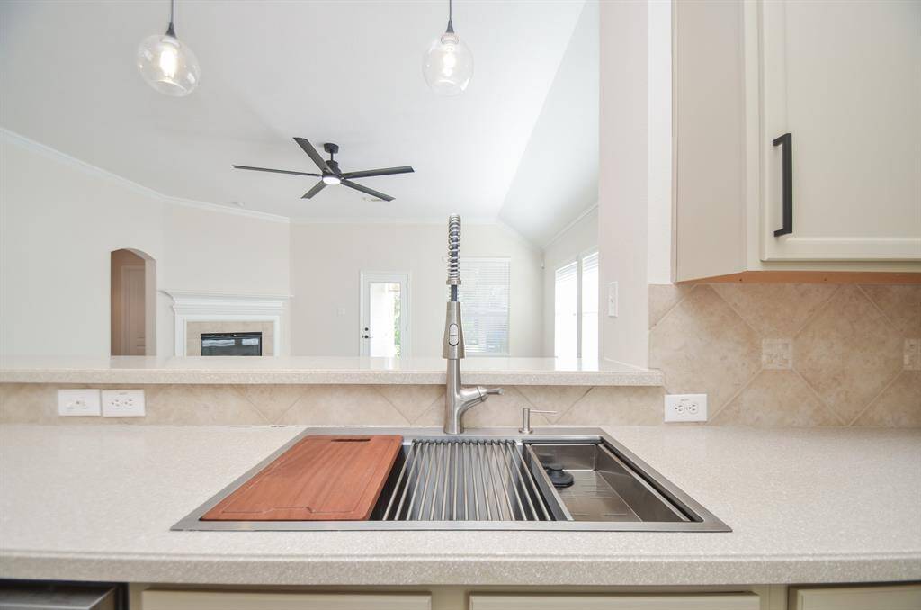 Picture yourself here, at the multi-tasking sink, popping open that saved, celebratory bottle of champagne as friends and family cheer you on from the heavenly living area, beyond.