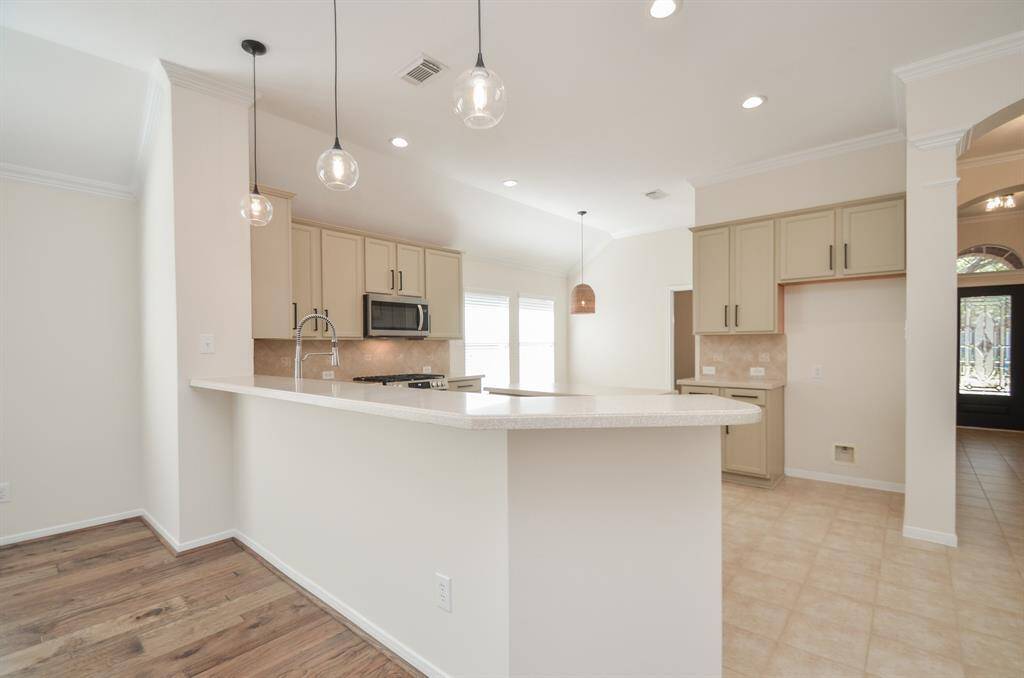 Where there are extended counters, there are stools waiting to be placed in this amazing space on the living area side, with wide open air all around, right up to the front door, right.