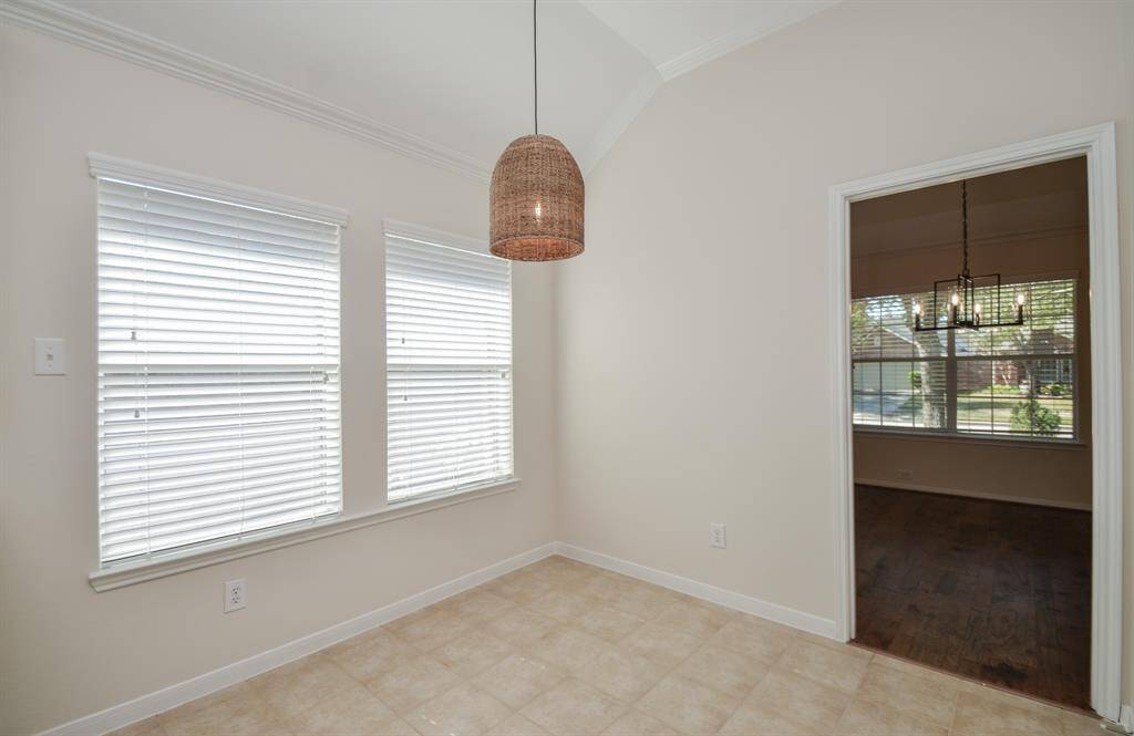 This sublime breakfast nook is bound to become 'family central' on weekdays and nights, with formal dining right  through the doorway, right.