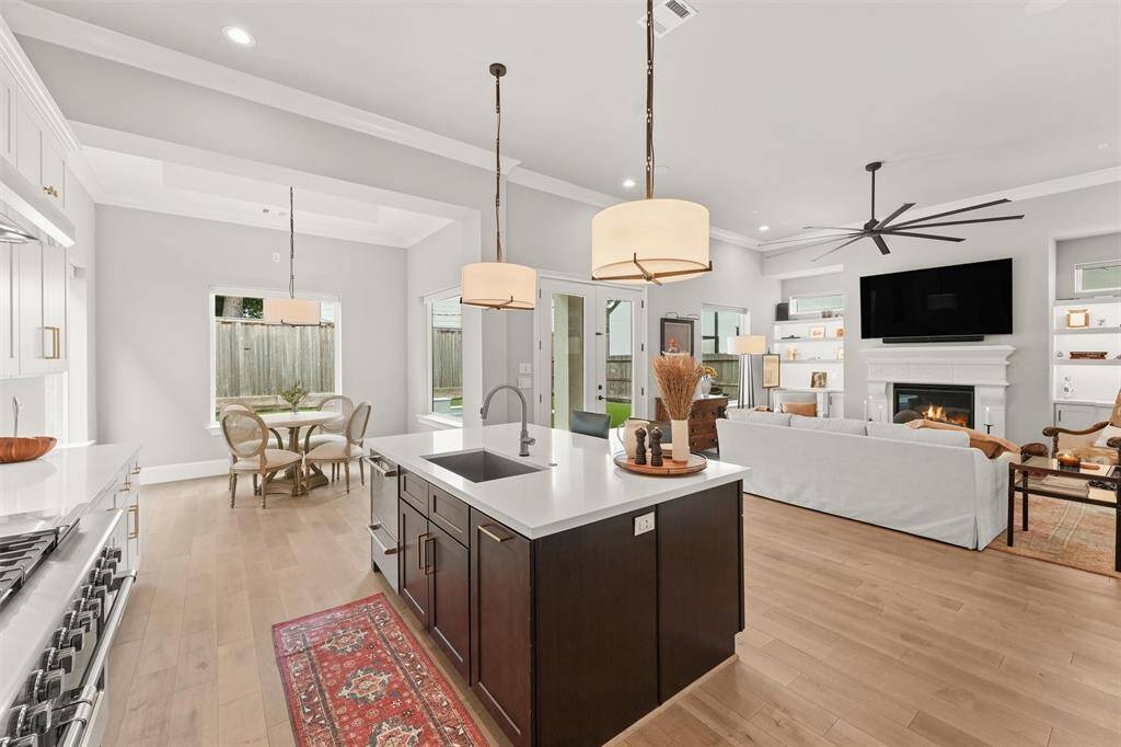 Never miss a moment in the open concept kitchen!