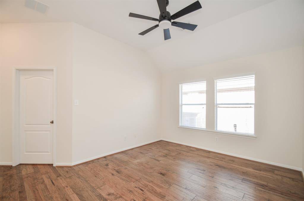 This home hosts a treasure trove of comforts, beginning with the primary suite; with high ceiling, neutral relaxing wall tones, big windows, and space galore for your favorite treasures.