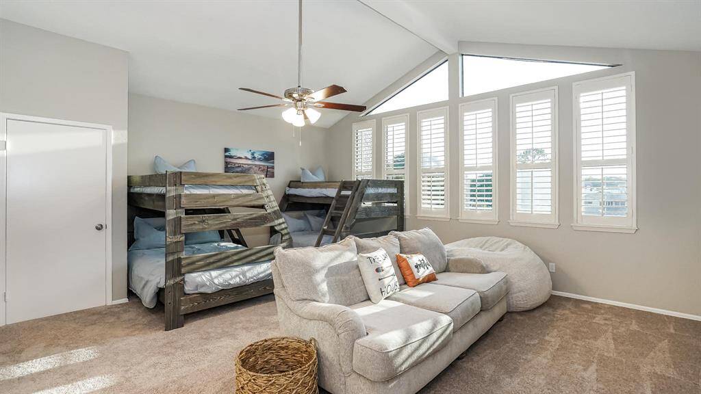 The fourthbedroom can also be used as a game room and has high ceilings, carpet, a ceiling fan and nice size closet.