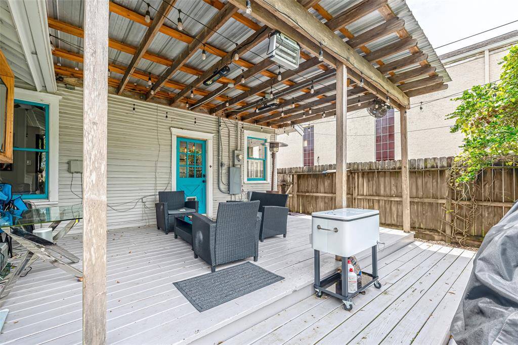 Enjoy the serene outdoor setting from the huge covered porch, perfect for morning coffee or evening relaxation.