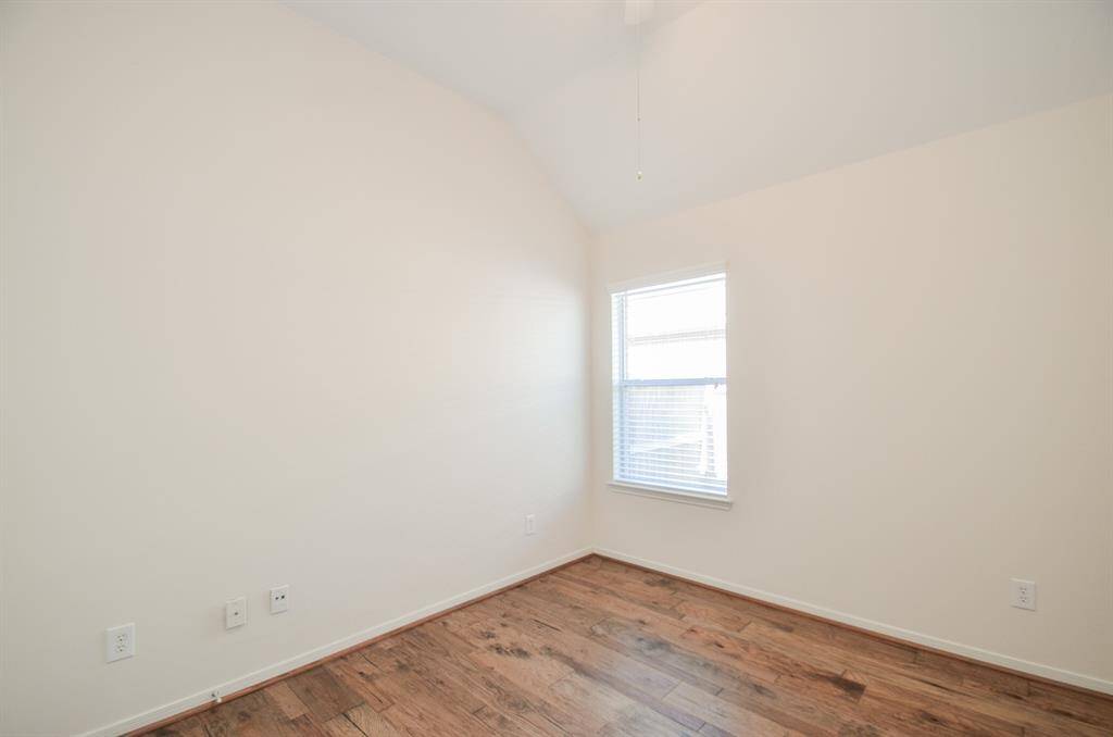 A corner window in a modest secondary bedroom leaves more physical space for your favorite furnishings.