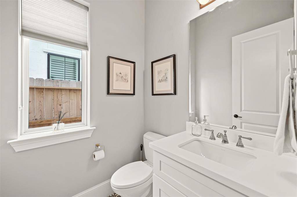 The half bathroom downstairs, conveniently located between the dining room and study. All the bathrooms have auto-off fans, and this bathroom also has an auto-off light.