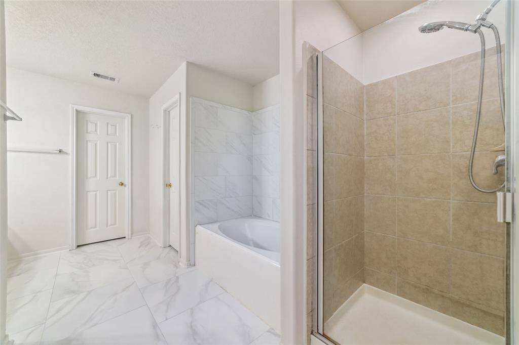 Shower and separate tub.