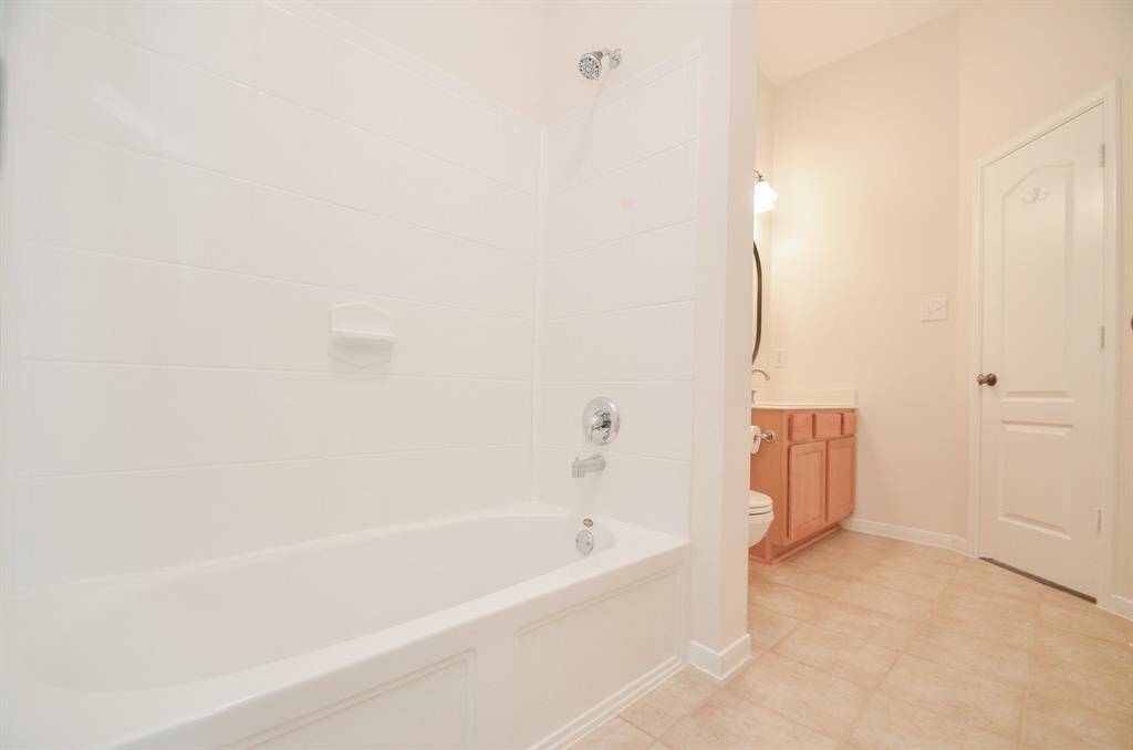 The combined soaking tub/shower hosts personal options.