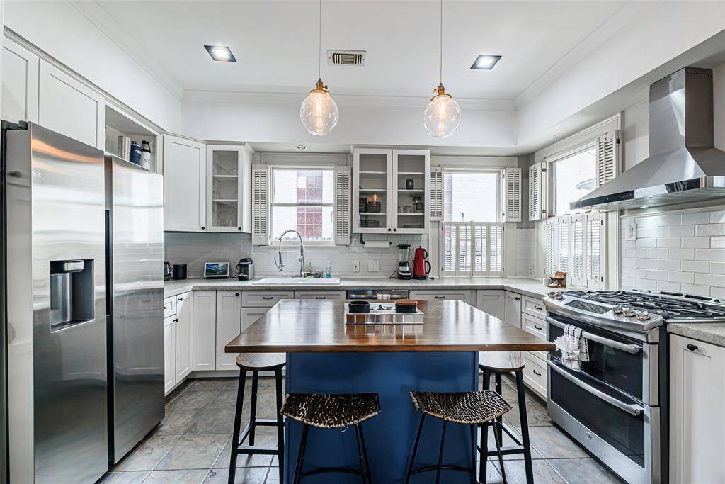 This inviting kitchen is beaming with natural light!