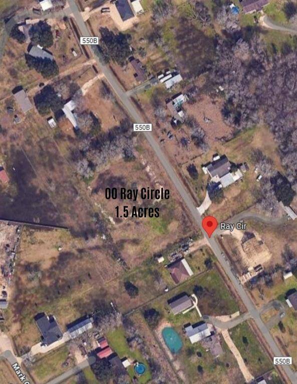This Google Maps image shows a spacious 1.5-acre lot on Ray Circle, surrounded by a few neighboring homes and open land. It's a quiet area with potential for development or a custom home build.