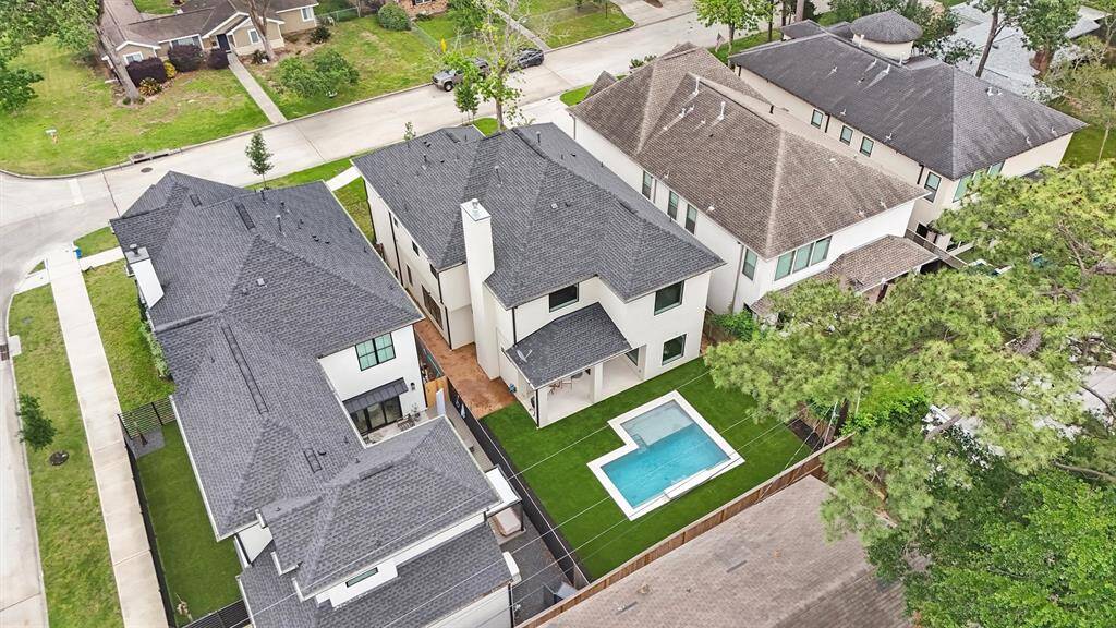An aerial view provides scale for the size of the backyard and property.