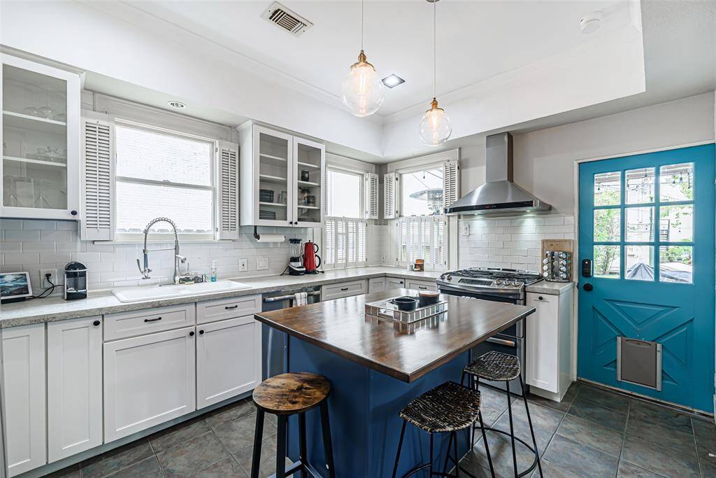 The butcher's block island allows for more seating and gathering.