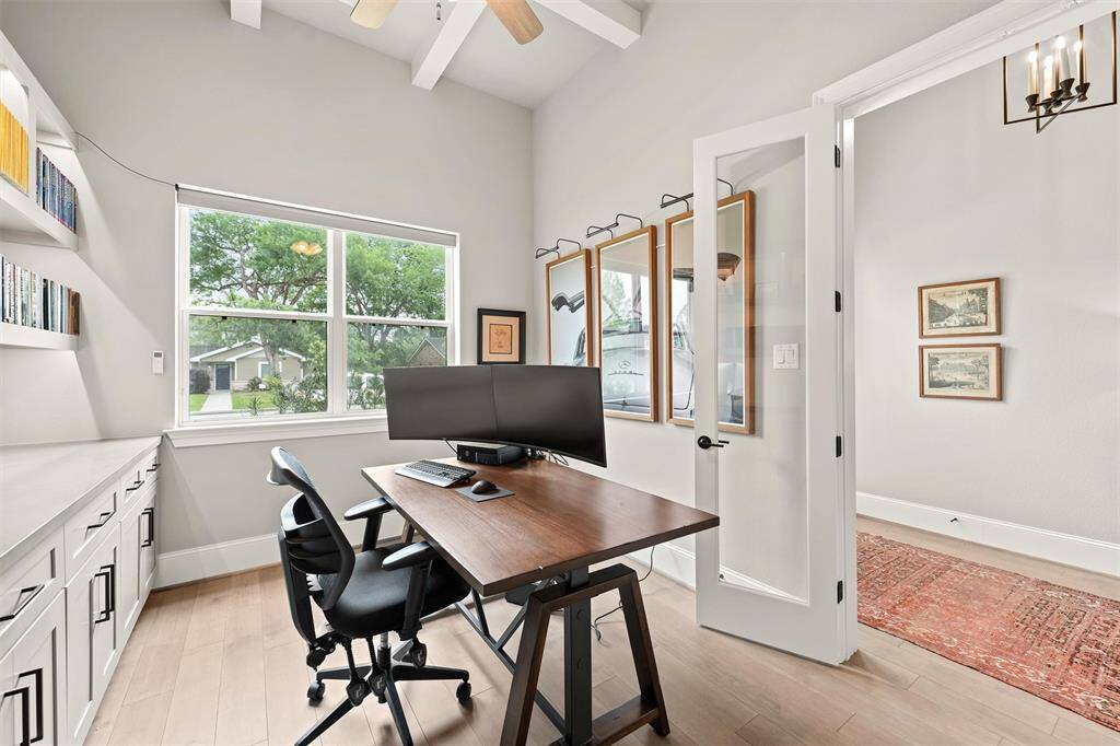 Assessible through double glass doors, this sizable study is light and bright! A motorized light-filtering shade from The Shade Store® is also on the front window.