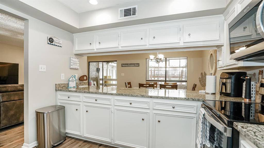 From this angle of the kitchen you can see it is open to the living room and dining area.