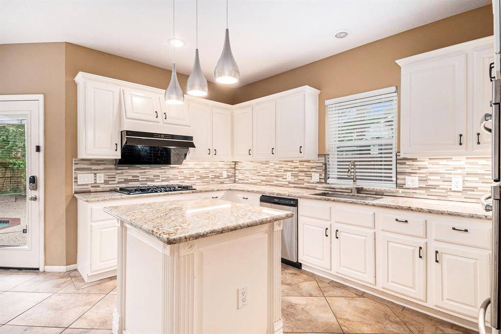 The chef in your family will love cooking in this large open style Kitchen. The island is great for prepping your favorite meals or buffet style dining. It features a granite top island with cabinet for storage.