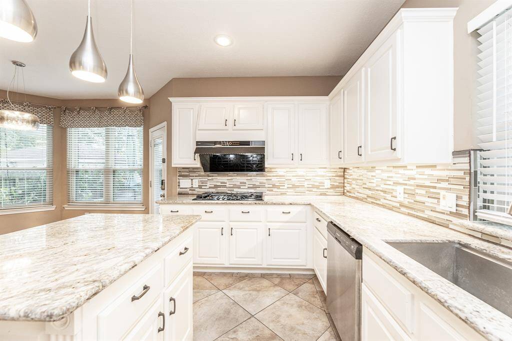 The chef in your family will love cooking in this large open style Kitchen. The island is great for prepping your favorite meals or buffet style dining. It features a granite top island with cabinet for storage.