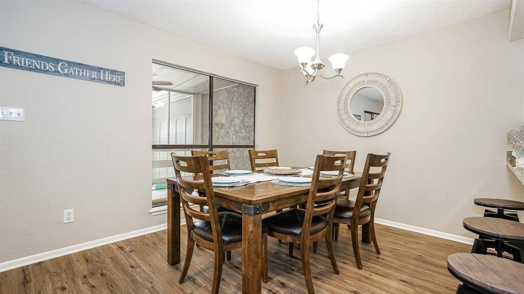 The dining room has laminate wood floors.