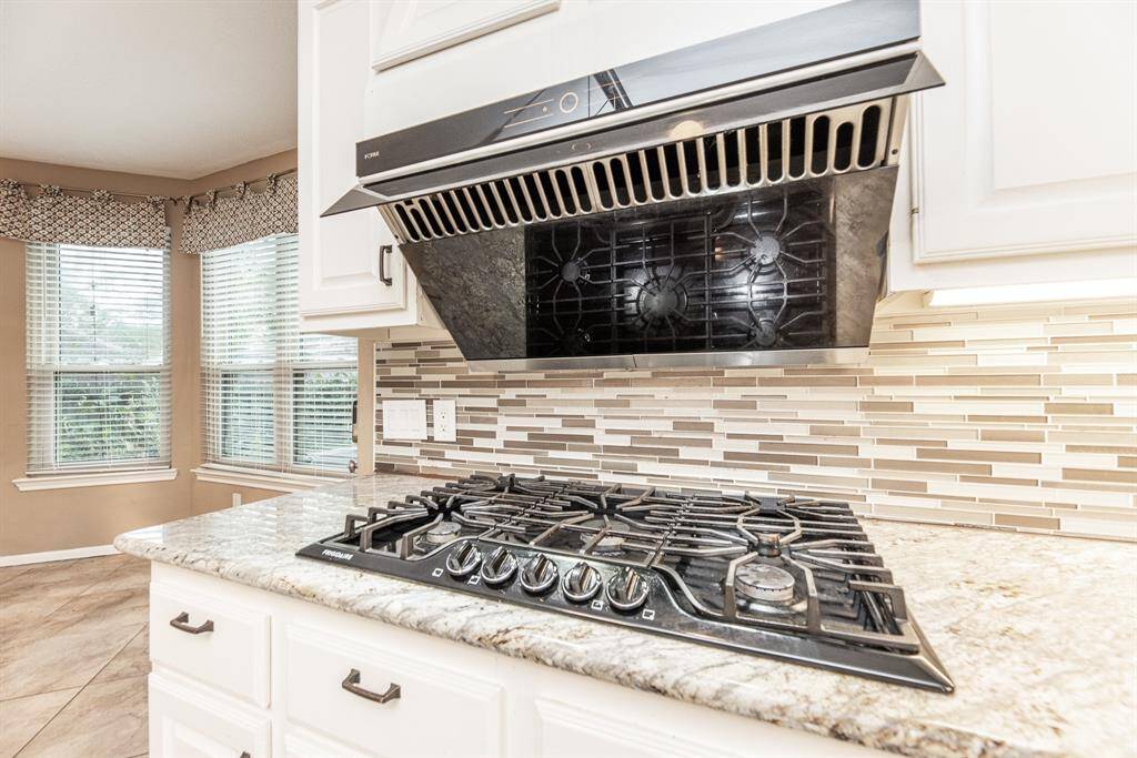 The formal dining room offers the perfect blend of sophistication and versatility, making it an ideal space for both formal gatherings and casual family meals.