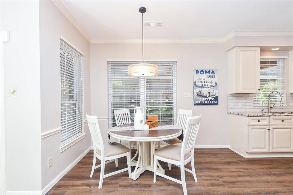 Breakfast area is spacious and open to kitchen and den
