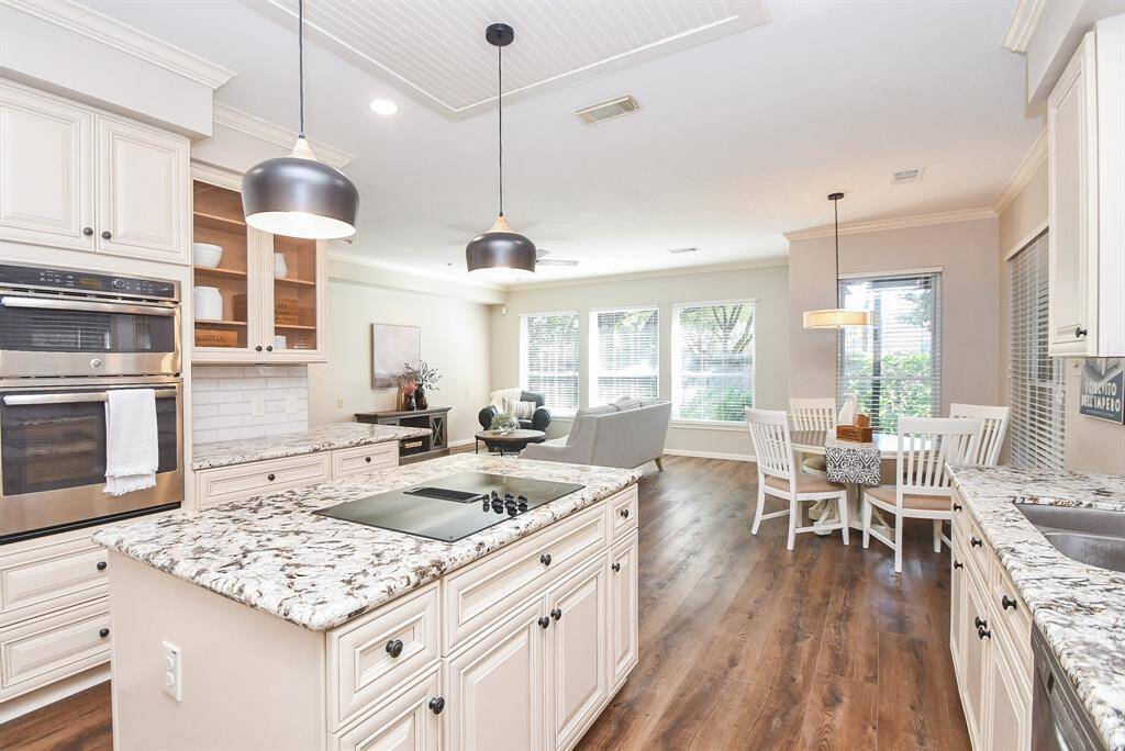 Kitchen is open to den and breakfast area