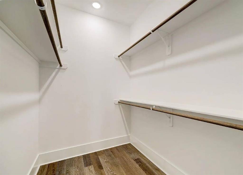 Primary bedroom walk-in closet off the bathroom.
