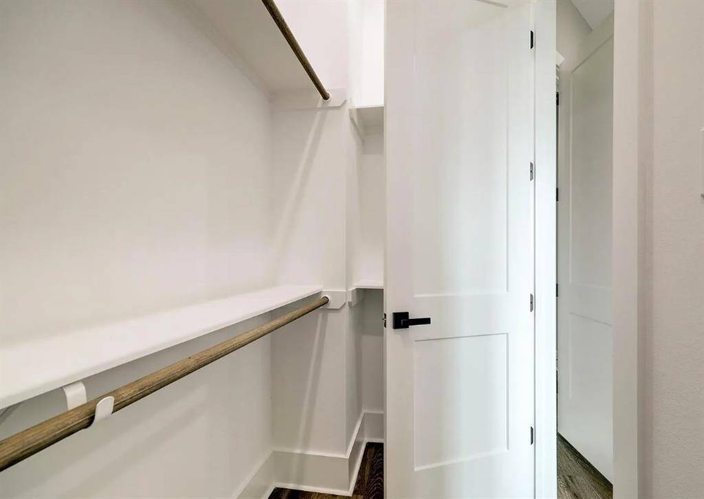 Primary bedroom walk-in closet from the bedroom. Yes- there are TWO!