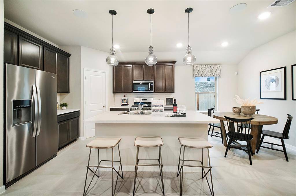 Sample photo of completed home with similar floor plan. As-built color and selections may vary.