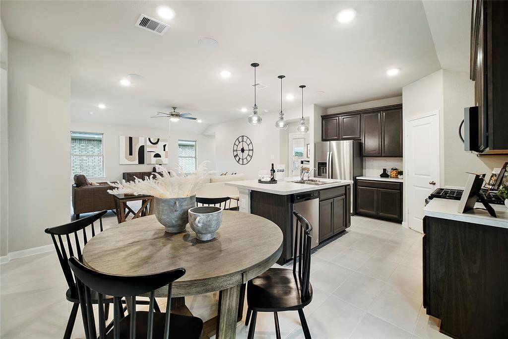 Sample photo of completed home with similar floor plan. As-built color and selections may vary.