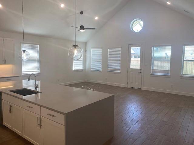 Kitchen overlooks sun-lit great room