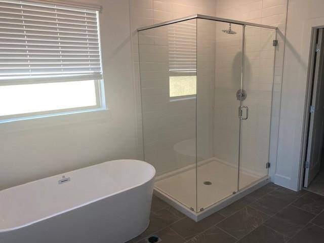 Freestanding tub and shower in primary bath