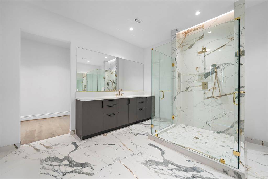 Primary bath: Elegant & functional with plenty of storage.