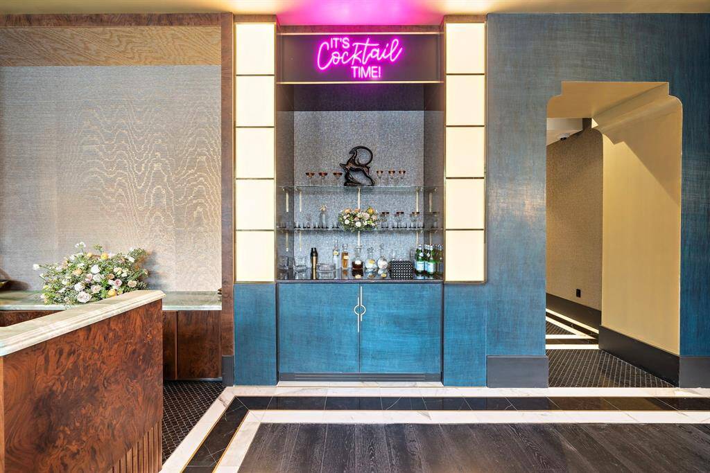 Lobby at London House features a chic bar area, designed for socializing and relaxation.