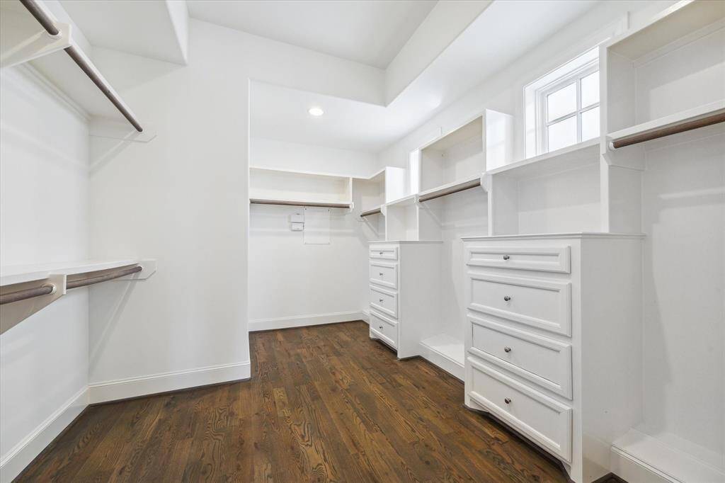 Generous primary walk-in closet with built-ins