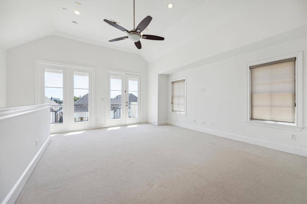 Versatile fourth floor den / game room / exercise room opens to south-facing terrace.