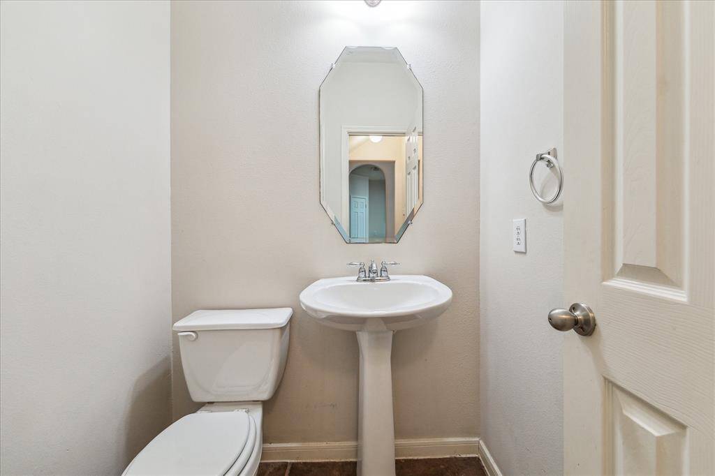Half bath right off the entry. Perfect and private space. There is also a small storage space with a door under the stairs that is perfect for storing household items like paper towels and other large kitchen items.
