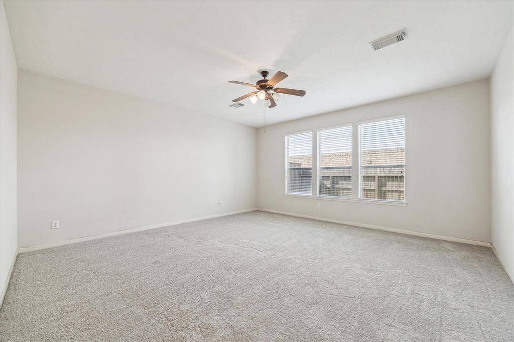 Oversized master bedroom with beautiful natural lighting.  New paint and new carpet throughout the entire house..