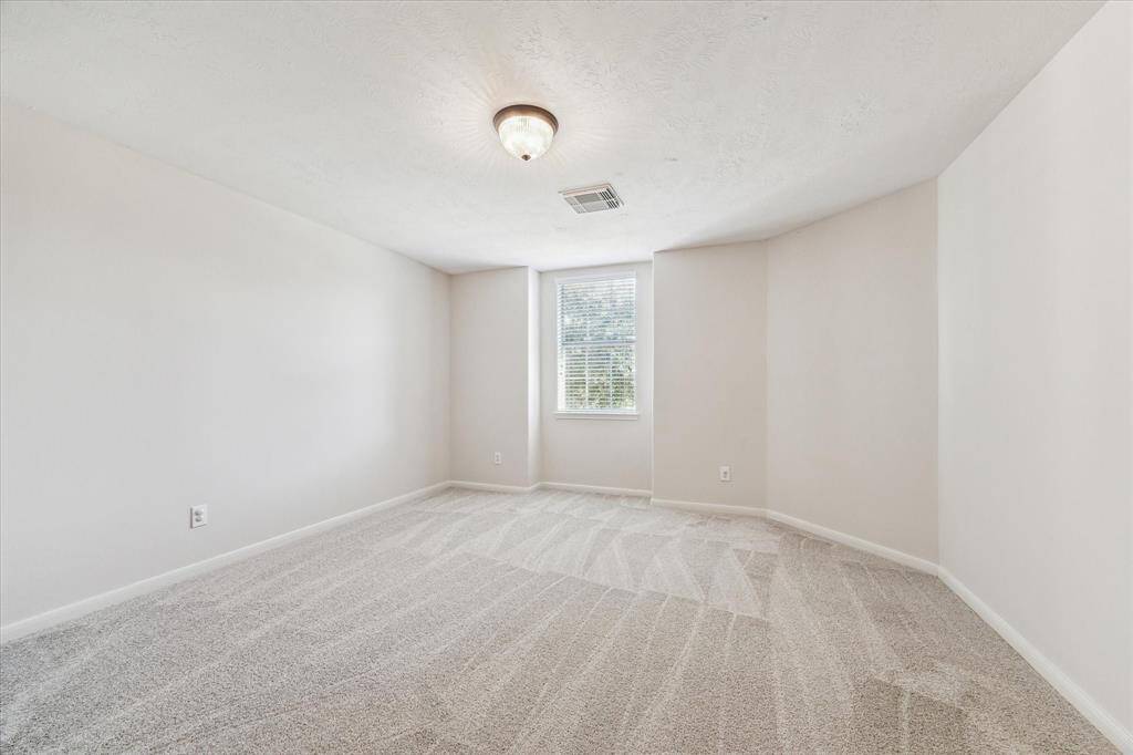 Bedroom number 2. Very large room with a large walk in closet.