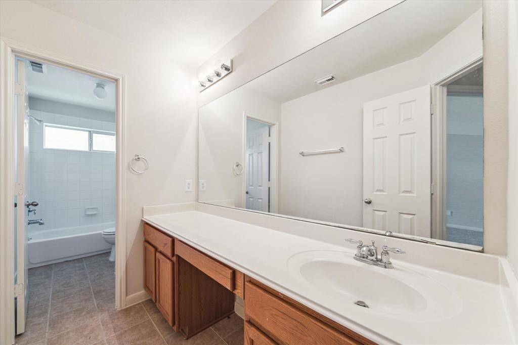 Guest bathroom upstairs for 2 rooms on one side.