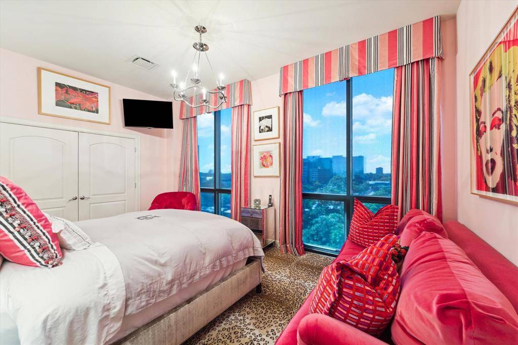 A secondary bedroom on the second floor with en-suite bathroom and lovely floor to ceiling windows. The 4th bedroom is adjacent to this room and currently being used as a work-out room and extra closet.