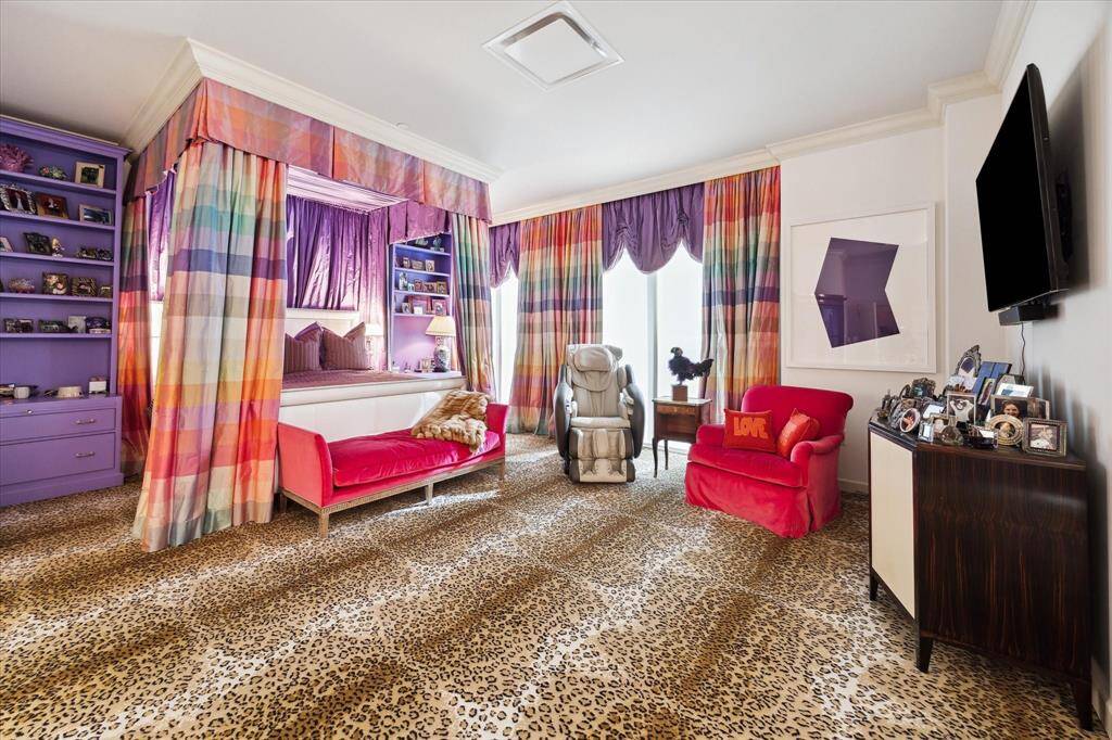 Another view of the primary bedroom .