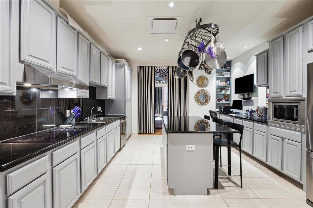 The gourmet kitchen has an office nook area and is adjacent to the family room.