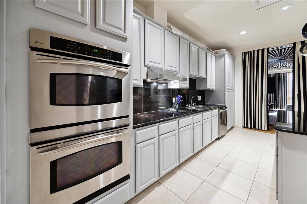 Top of the line stainless steel kitchen appliances and plenty of storage.